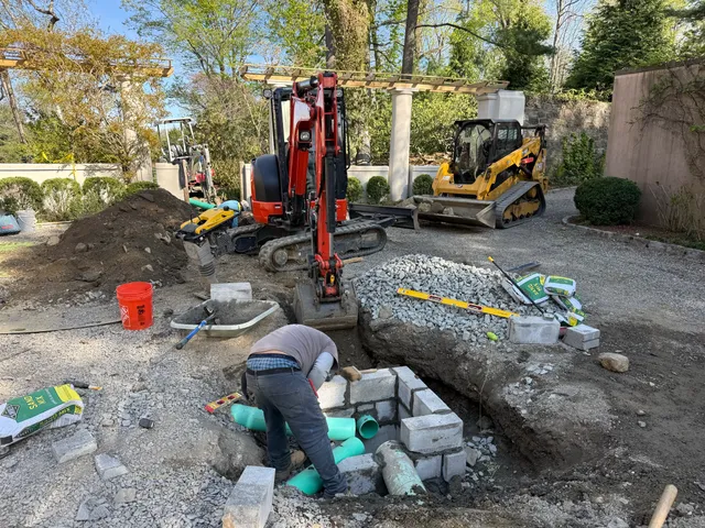 Building a block catch basin at the edge of a driveway