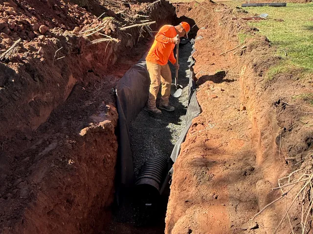 Corrugated drain pipe set deep in a trench at a park
