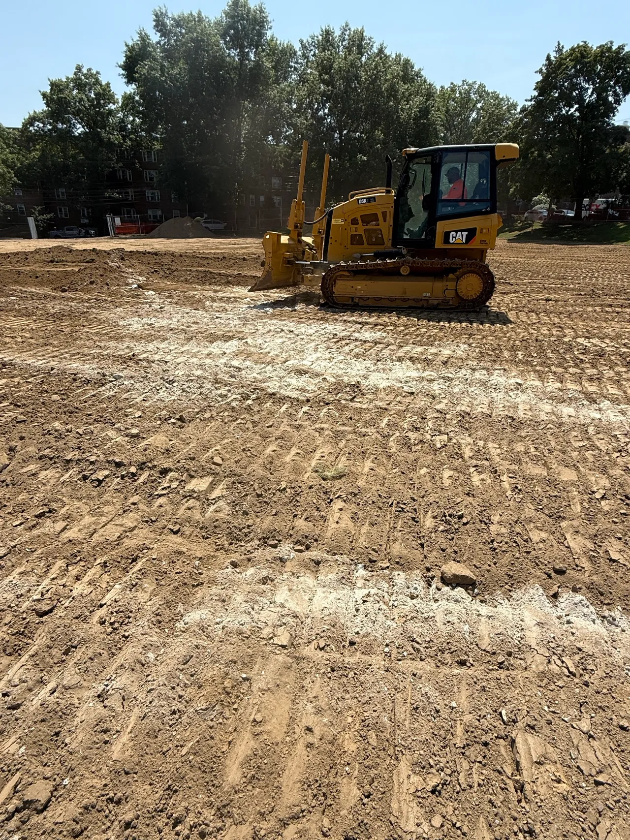 Dozer grading a field in even passes