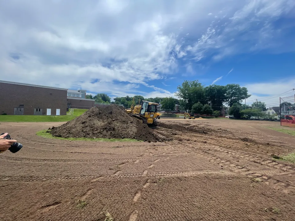 Dozer rough grading a field