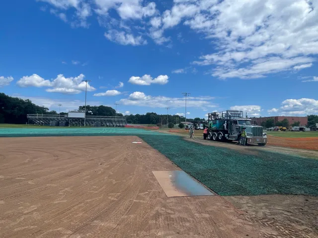 Hydroseed truck finishing a graded field