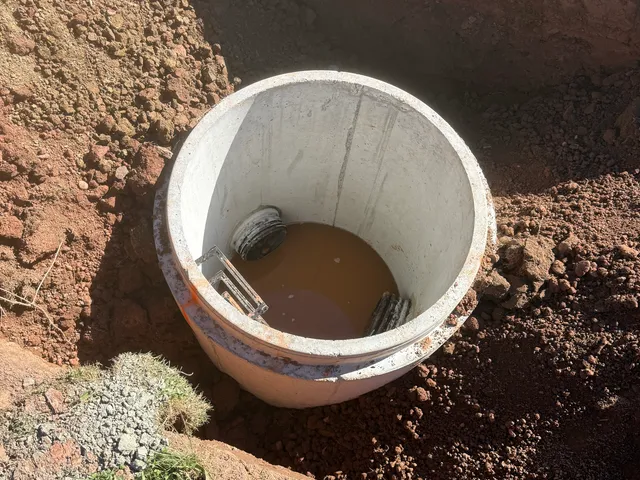 Precast drain riser set and backfilled