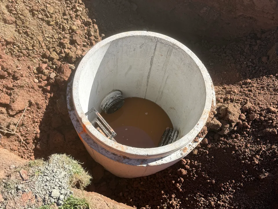 Precast drain riser set and backfilled