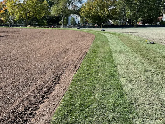 Sod installation in progress on a large field