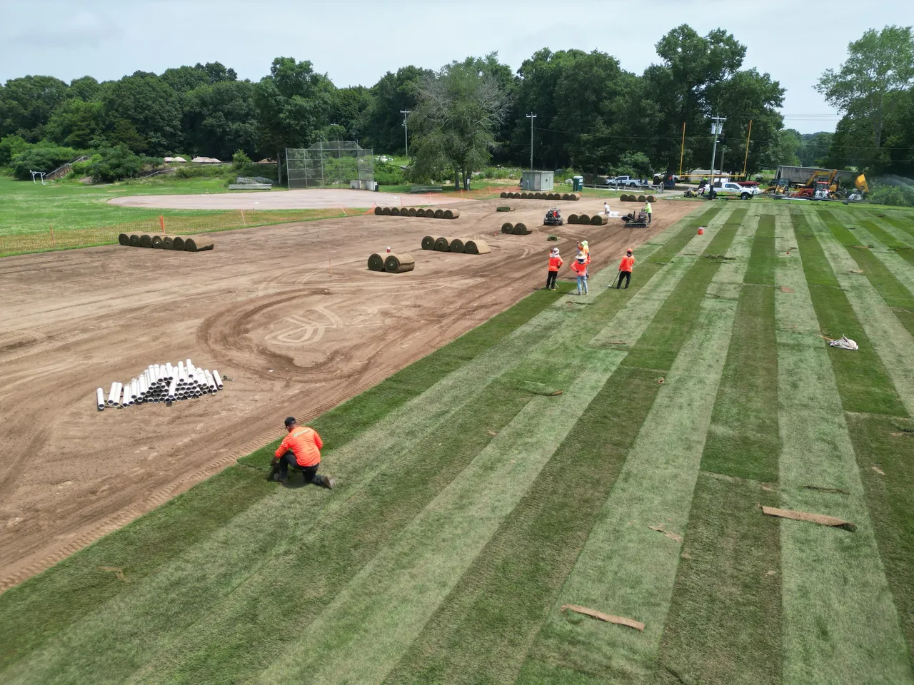 Large-scale sod installation on a field, drone view